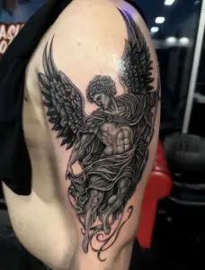 Black and grey angel tattoo by Kylie, Calgary Tattoo Company