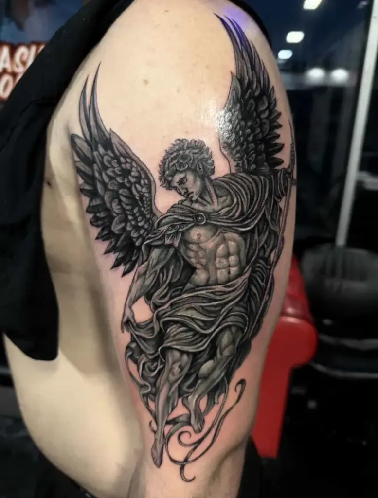 Black and grey angel tattoo by Kylie, Calgary Tattoo Company