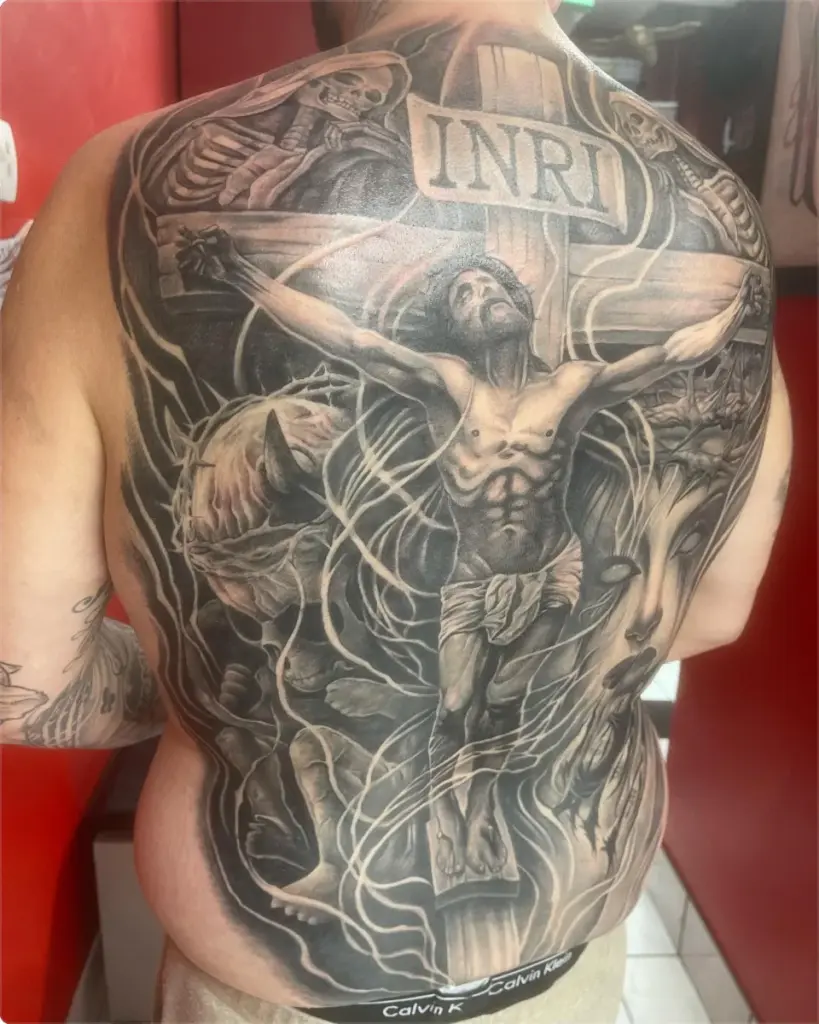Black and grey crucifixion back piece tattoo by Moose, Calgary Tattoo Company