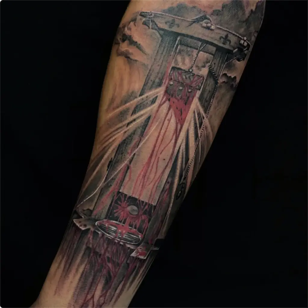 Black and grey guillotine tattoo by Moose, Calgary Tattoo Company
