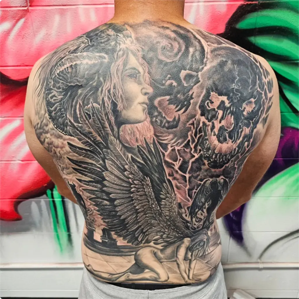 Black and grey horned angel back piece tattoo by Tonka, Calgary Tattoo Company