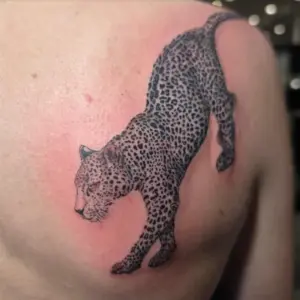Black and grey leopard tattoo by Tonka, Calgary Tattoo Company