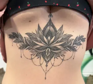 Black and grey ornamental lotus sternum tattoo by Moose, Calgary Tattoo Company