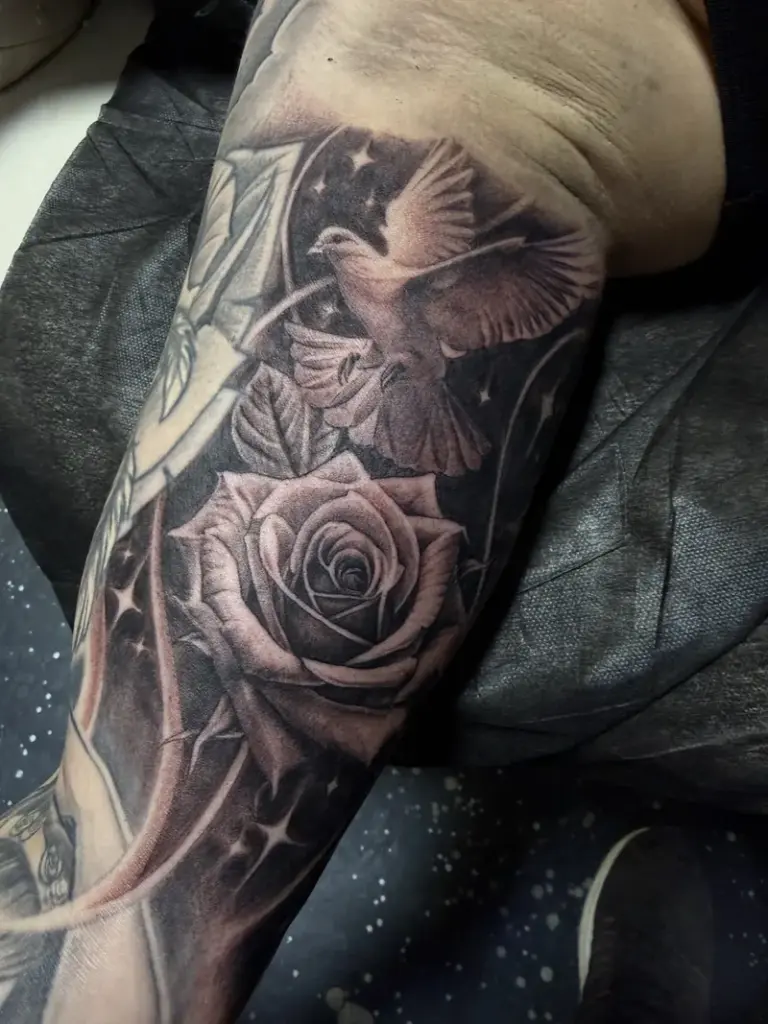 Black and grey rose and dove tattoo by Moose, Calgary Tattoo Company