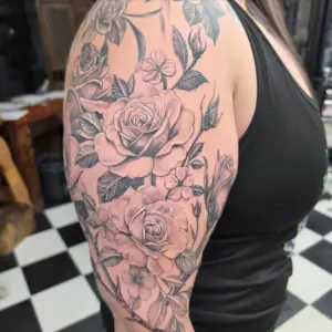 Black and grey rose half sleeve tattoo by Tonka, Calgary Tattoo Company