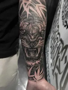 Black and grey tiger tattoo by Kylie, Calgary Tattoo Company