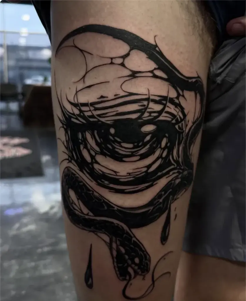 Blackwork eye and snake tattoo by Kylie, Calgary Tattoo Company
