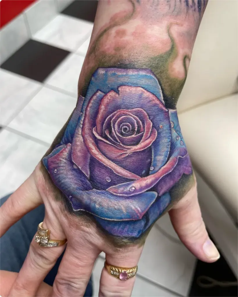 Colour purple and blue rose tattoo by Moose, Calgary Tattoo Company