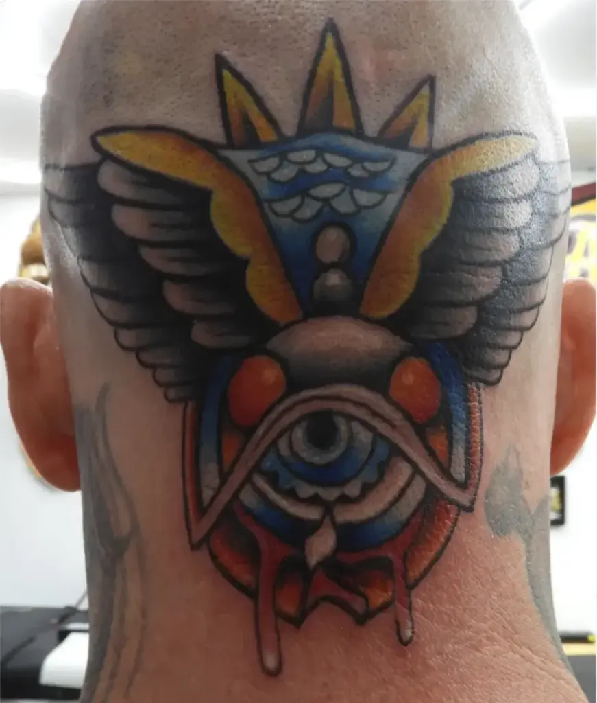 Colour traditional all-seeing eye with wings tattoo by Keith, Calgary Tattoo Company