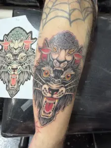 Colour wolf in sheep's clothing forearm tattoo by Moose, Calgary Tattoo Company