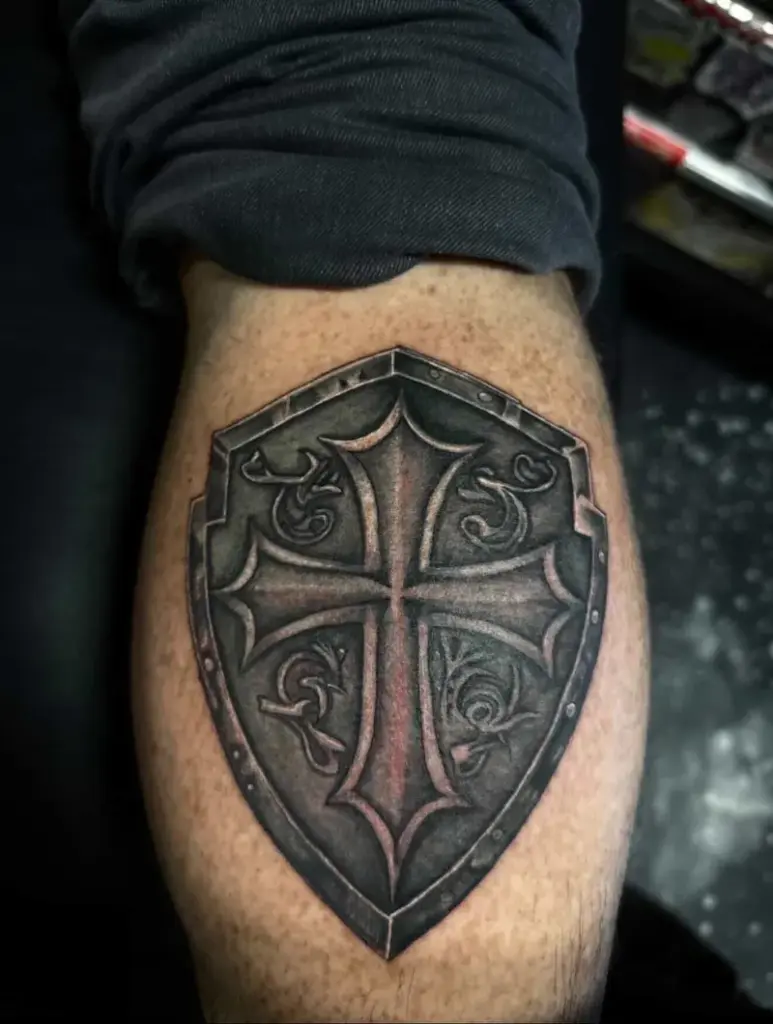 Cross and shield tattoo by Kylie, Calgary Tattoo Company