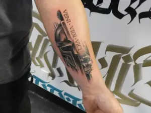 Lettering and helmet tattoo by Keith, Calgary Tattoo Company